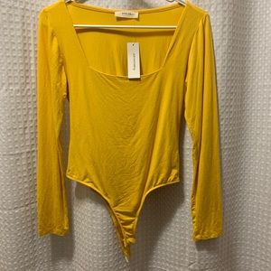 Yellow body suit, never worn!
